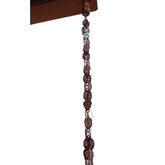 A decorative hanging chain featuring colorful beads interspersed with a sturdy brown metal chain.